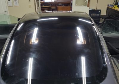 2019 Tesla model 3 Gray rear window heat shrunk at encore window tinting